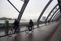 Blurry motion image of women riding a bicycles