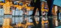 The blurry motion of passenger and luggage cart in front of check-in counter desk