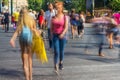 Blurry people walking in the street