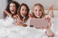 Blurry photo of happy smiling women 20s wearing white bathrobe l