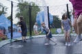 Blurry photo of kids having fun on a trampoline Royalty Free Stock Photo