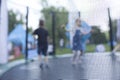 Blurry photo of kids having fun on a trampoline Royalty Free Stock Photo