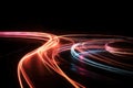 a blurry photo of a street light at night with a long exposure of the lights on the road and the cars on the road Royalty Free Stock Photo