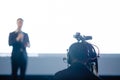 Blurry picture of video camera set record speaker and audience in conference hall seminar event. Company meeting, exhibition Royalty Free Stock Photo