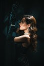 Blurry portrait of a woman in the style of a classic retro Hollywood movie of the 1950s. Elegant young girl with a Royalty Free Stock Photo
