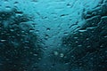 Blurry rain drops on window glasses surface with cloudy background Royalty Free Stock Photo