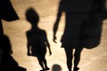 Blurry shadow of a child and mother walking