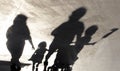 Blurry shadow silhouette of a family walking  on a summer day Royalty Free Stock Photo