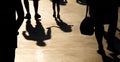 Blurry shadow silhouette of father and daughter walking in crowd