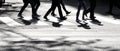 Shadow silhouette of a pedestrians crossing city street Royalty Free Stock Photo