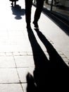 Blurry shadow silhouette of people walking, in black and white