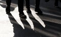 Blurry shadow silhouette of two  people walking on city pedestrian street Royalty Free Stock Photo