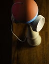 Blurry shape of kendama Japan toy on wooden board, selective focus