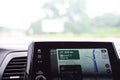 Blurry street view and Welcome to Oklahoma text message on screen of real-time GPS navigation map application on display