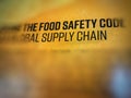 Blurry text and highlighting of food safety and supply chain