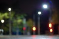 Blurry traffic lights background at night, empty city defocused view Royalty Free Stock Photo