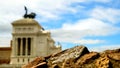 Blurry view of the Victorian from behind an ancient wall. also called Altare della Patria
