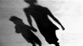 Blurry vintage shadows silhouettes of mother and daughter walking Royalty Free Stock Photo