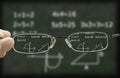 Blurry vision of a chalkboard corrected by the glasses