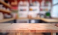 A blurry workplace in the kitchen with an empty wooden countertop in front of, generative AI Royalty Free Stock Photo