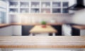 A blurry workplace in the kitchen with an empty wooden countertop in front of, generative AI Royalty Free Stock Photo