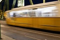 The blurry yellow train move on the speed on the bridge in Hungary Royalty Free Stock Photo