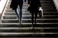 Blurry young man and woman going down the subway stairs Royalty Free Stock Photo