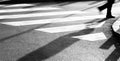 Blurry zebra crossing with person silhouette and shadow Royalty Free Stock Photo