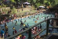 Blurs. People bathe in cold and clean rocky mountain spring water river. Royalty Free Stock Photo