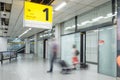 Blury passenger or tourist at the arrival terminal 1