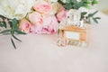 Blush pink bridal shoes and bottle of perfume. Close up and top view.The bride`s shoes and perfume. Heeled shoes. Pink fragrance. Royalty Free Stock Photo
