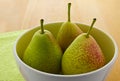 Blushed Forelle pears in white bowl (Pyrus)