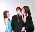 Blushing boy and teen girls flirting Royalty Free Stock Photo