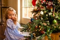 Blushing Over The Christmas Tree Royalty Free Stock Photo