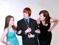 Blushing Teen boy with two girls Royalty Free Stock Photo