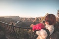 Blyde River Canyon, famous travel destination in South Africa. Tourist taking photo with smartphone at sunset from the terrace