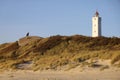 BLÃÂ¥VAND, DENMARK - Nov 08, 2020: Bunker and lighthouse at Blaavandshuk beach