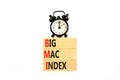 BMI big mac index symbol. Concept words BMI big mac index on wooden blocks on a beautiful white table white background. Black Royalty Free Stock Photo