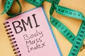BMI body mass index sign and measuring tape