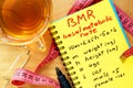 BMR basal metabolic rate formula in a notepad. Royalty Free Stock Photo