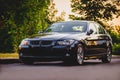 BMW black car at sunset