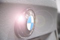 BMW car icon with flashing ray on gray background. Symbol manufacturer of cars BMW