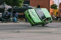 BMW car rides sideways on two wheels, at an auto show in the city of Halle Saale, Germany, 04.082019