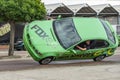 BMW car rides sideways on two wheels, at an auto show in the city of Halle Saale, Germany, 04.082019