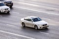 bmw cars driving on the highway, aerial side view