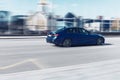 BMW 320d M Sport G20 moving fast on the street of Moscow. BMW 3 Series car driving on the road with blurred background