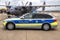 BMW 318d Touring of the German Police of Nordrhein-Westfalen in front of a Polish Navy M28 Skytruck at NATO base Geilenkirchen. Royalty Free Stock Photo