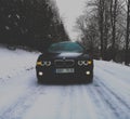 Bmw e39 on a winter road. Royalty Free Stock Photo