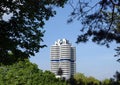 BMW Headquarter building in Munich inside tree branches frame on sunny day Royalty Free Stock Photo