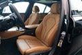 BMW 530 interior view from outside, door open, brown leather seats Royalty Free Stock Photo